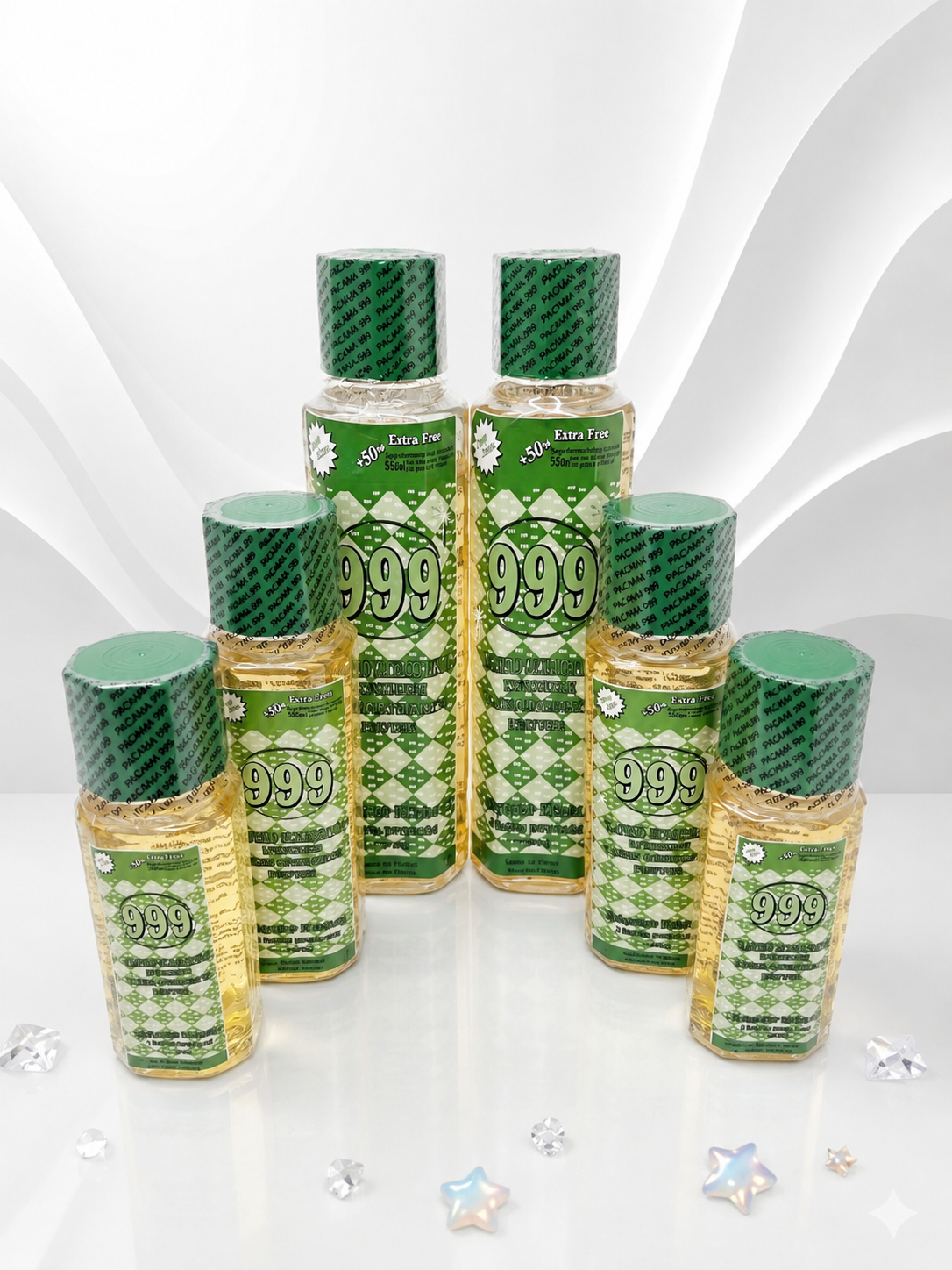 Multiple bottles of 999 products with green and gold labels on a white background