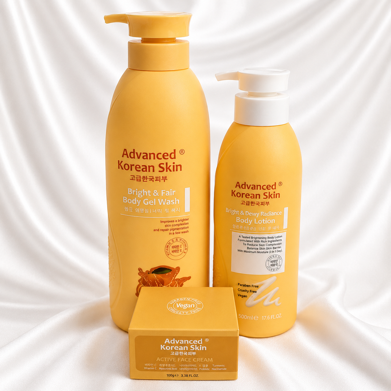 Three Advanced Korean Skin body care products arranged on a white satin fabric background: a tall Bright & Fair Body Gel Wash bottle, a tall Moisture Repair Body Lotion bottle with a white pump, and a smaller Moisture Repair Balm box in front.