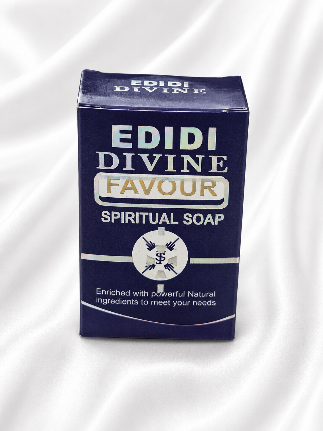 A dark blue rectangular box of Edidi Divine Favour Spiritual Soap, displayed on a draped white fabric background.