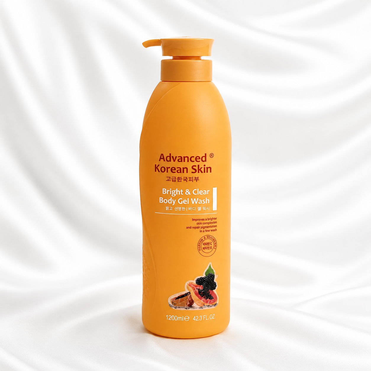 A 1200ml bottle of Advanced Korean Skin Bright & Clear Body Gel Wash, in a bright orange color with a matching orange pump dispenser, set against a draped white fabric background.