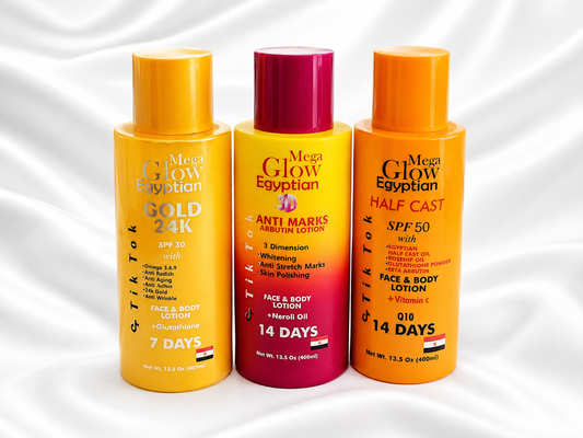 Three Egyptian face and body lotion bottles: Gold 24K, Anti Marks, and Half Cast