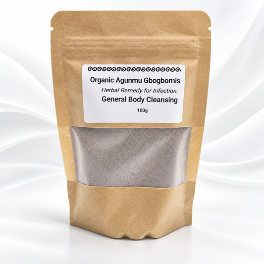 A stand-up kraft paper pouch with a clear window showing a gray herbal powder, labeled 'Organic Agunmu Gbogbomis' on a white label, set against a white background with soft gray wave patterns.