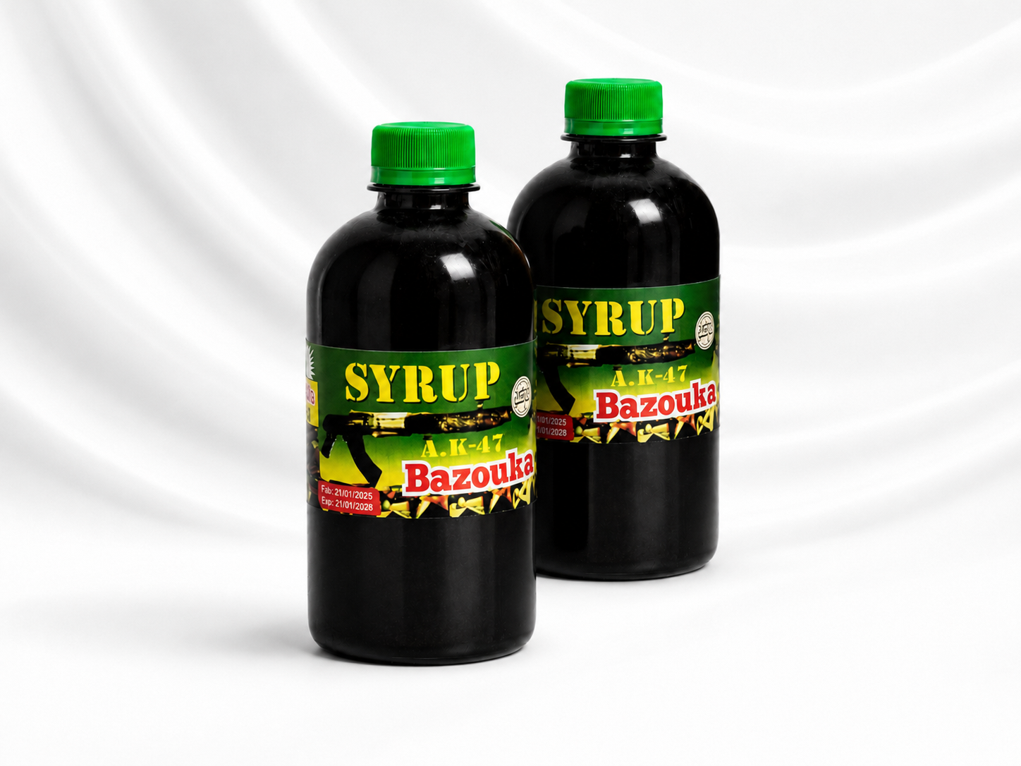 Two dark glass bottles of Agit Bazouka syrup with green caps and green/yellow labels, shown on a white draped background.