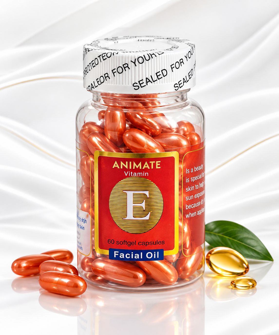 A clear plastic bottle of Animate Vitamin E Facial Oil capsules, filled with orange-red softgel capsules, with a few capsules scattered on a white reflective surface. The bottle features a red and gold label and a white seal cap with black text.