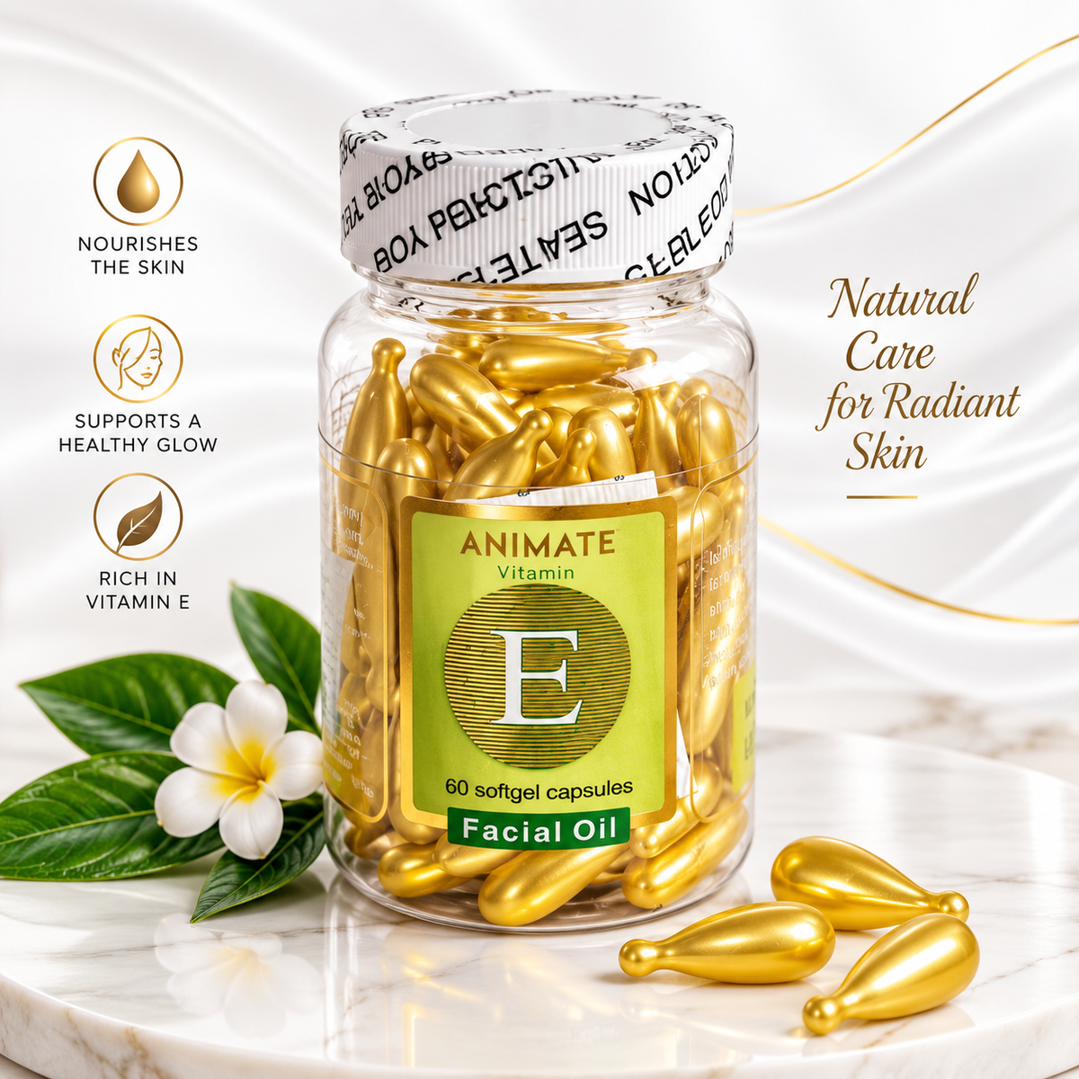 A clear glass jar of Animate Vitamin E Facial Oil capsules filled with gold softgel capsules, displayed on a white marble surface with decorative leaves and a white flower. The jar features a green label with a large gold 'E' and a white cap with black text.