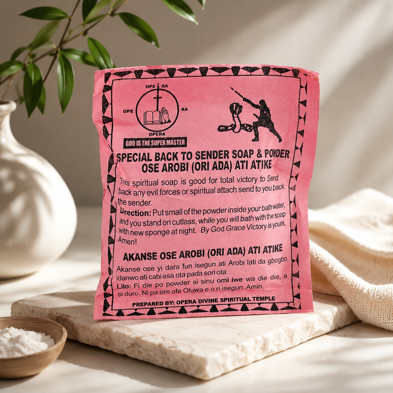 Pink and black packaging for 'Special Back to Sender Soap & Powder' by Opera Divine Spiritual Temple, displayed on a textured white towel with a small bowl of white powder and green leaves in the background.