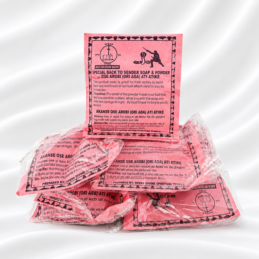 Pink ritual soap and powder packets with printed red and black labels, arranged on a white studio background.