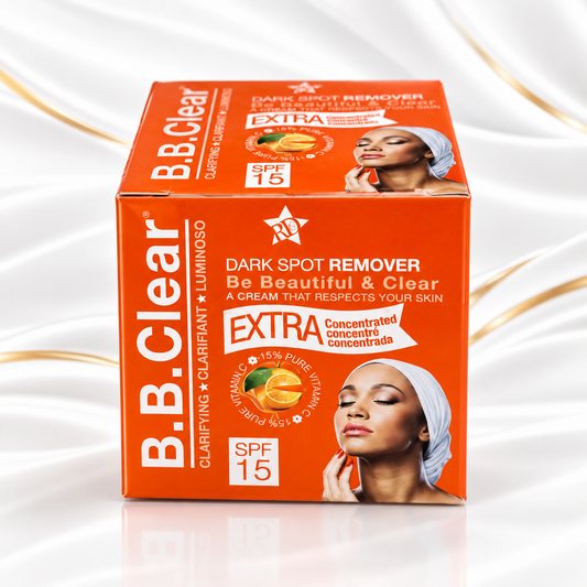B.B. Clear Dark Spot Remover SPF 15 Extra cream in an orange box, displayed on a white background with elegant gold ribbons.