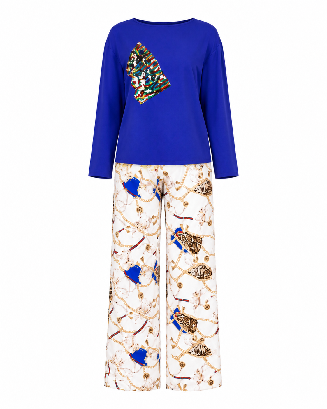 A two-piece women's lounge set featuring a royal blue long-sleeve top with a colorful abstract graphic on the left chest, paired with wide-leg pants in an off-white marble pattern decorated with gold chains, blue abstract shapes, and brown/gold animal motifs.