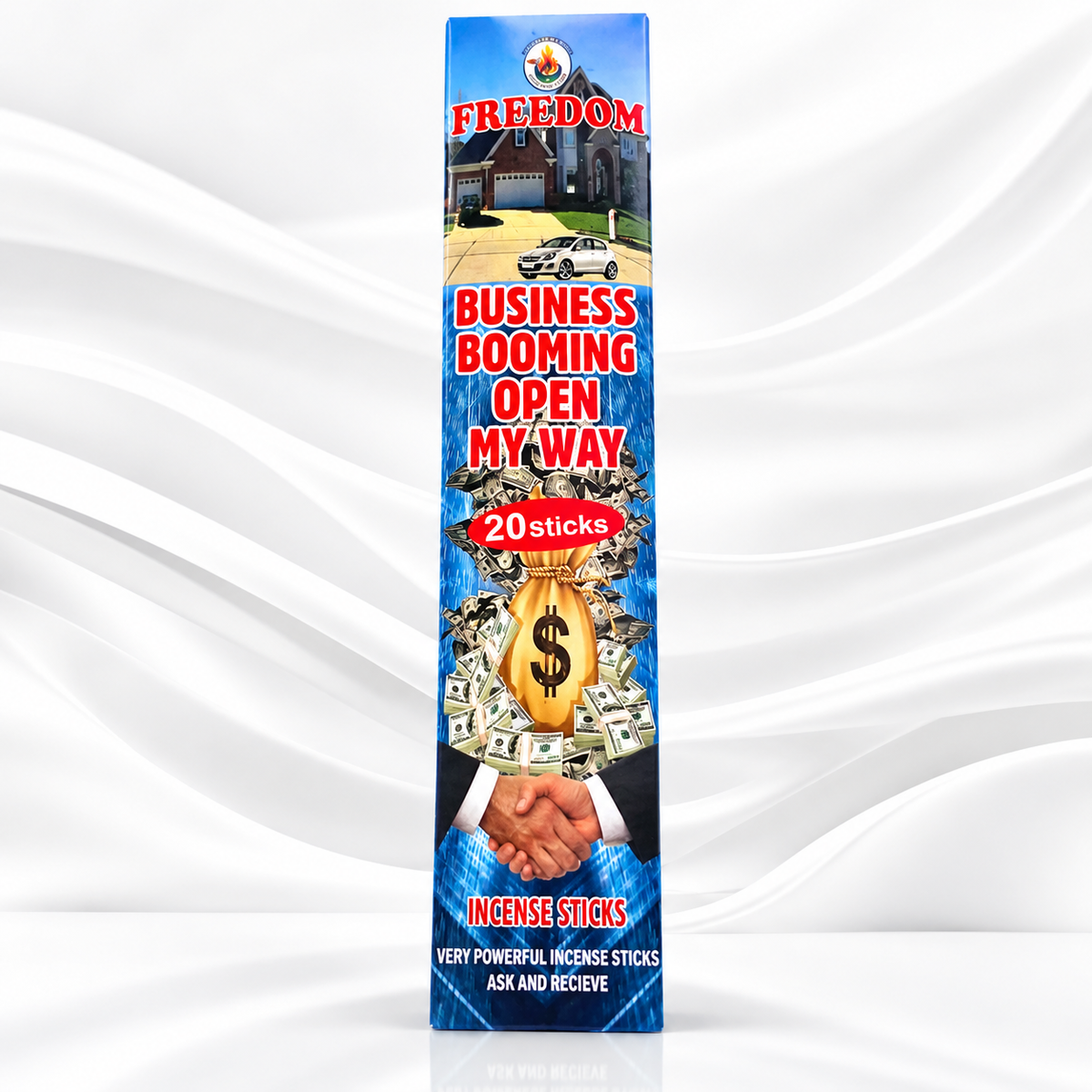 A tall rectangular box of Freedom Business Booming Open My Way incense sticks, featuring a blue background with a money bag, handshake, and house illustration, set against a white draped fabric backdrop.