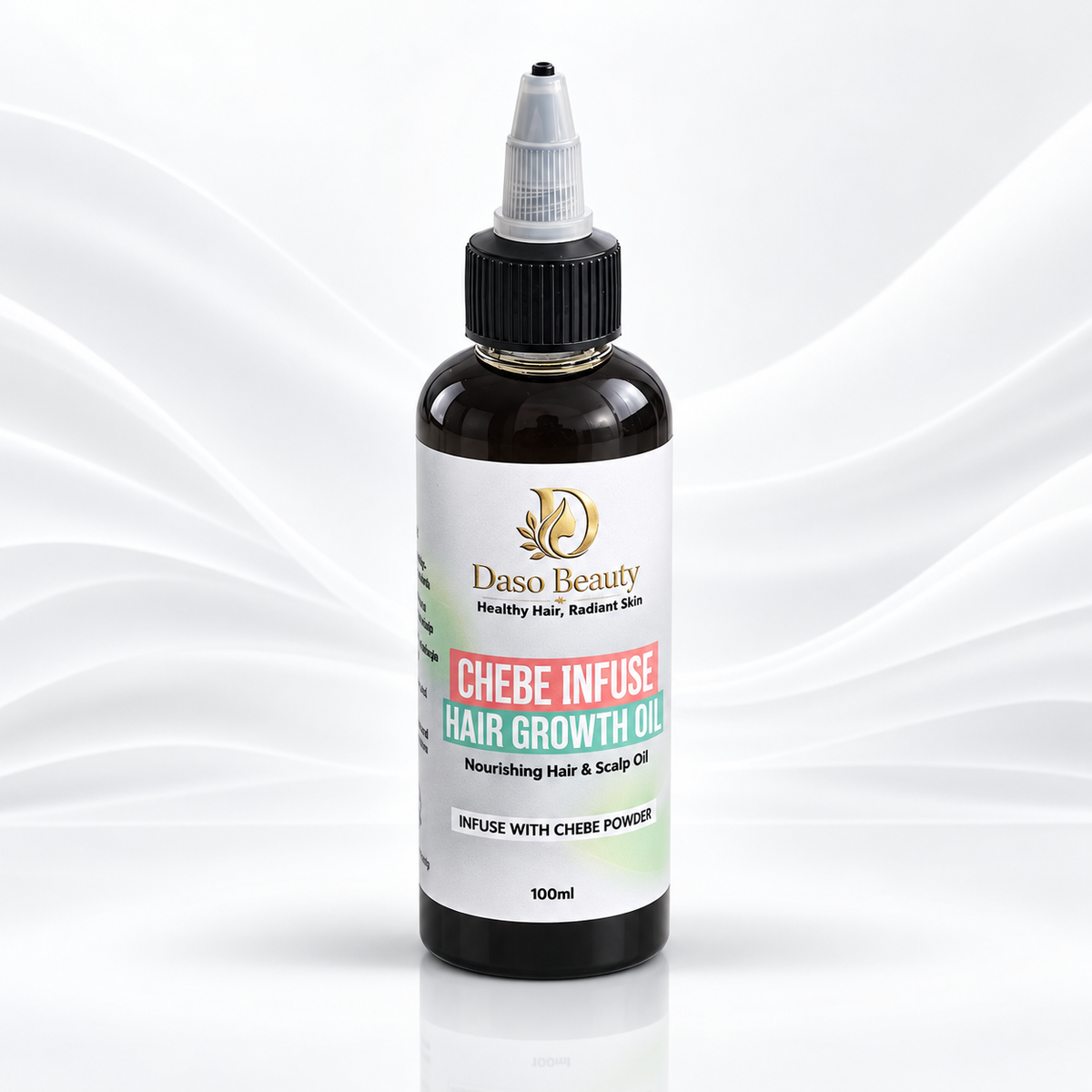 A 100ml bottle of Daso Beauty Chebe Infuse Hair Growth Oil, featuring a dark amber glass bottle, black cap, and a white label with red and green accents, set against a white background with elegant wavy lines.