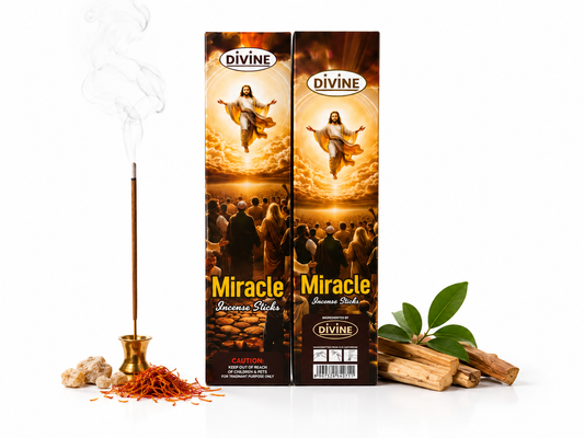 Divine Miracle incense sticks with one lit incense stick beside two boxed packs