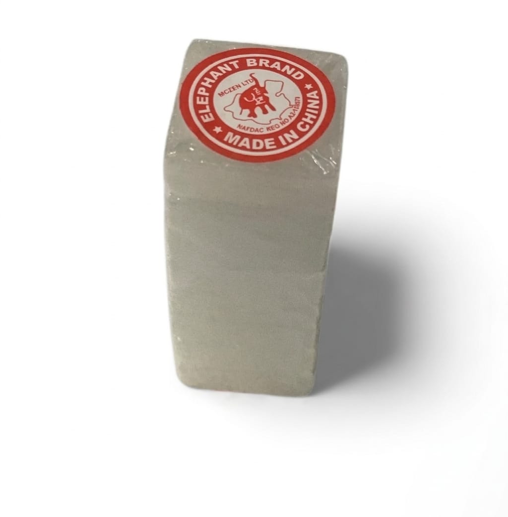 A rectangular, light gray stone or resin block wrapped in clear plastic, featuring a red circular 'Elephant Brand Made in China' sticker on top, set against a plain white background with a soft shadow.