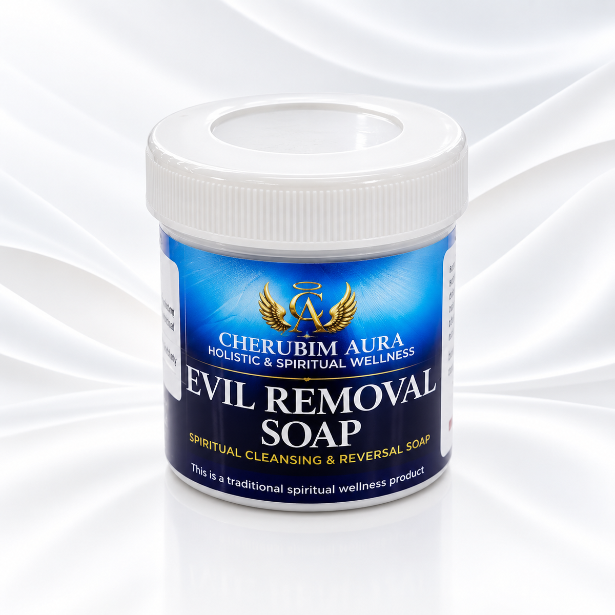 A white plastic jar of Cherubim Aura Evil Removal Soap with a blue and white label, set against a white satin fabric background.