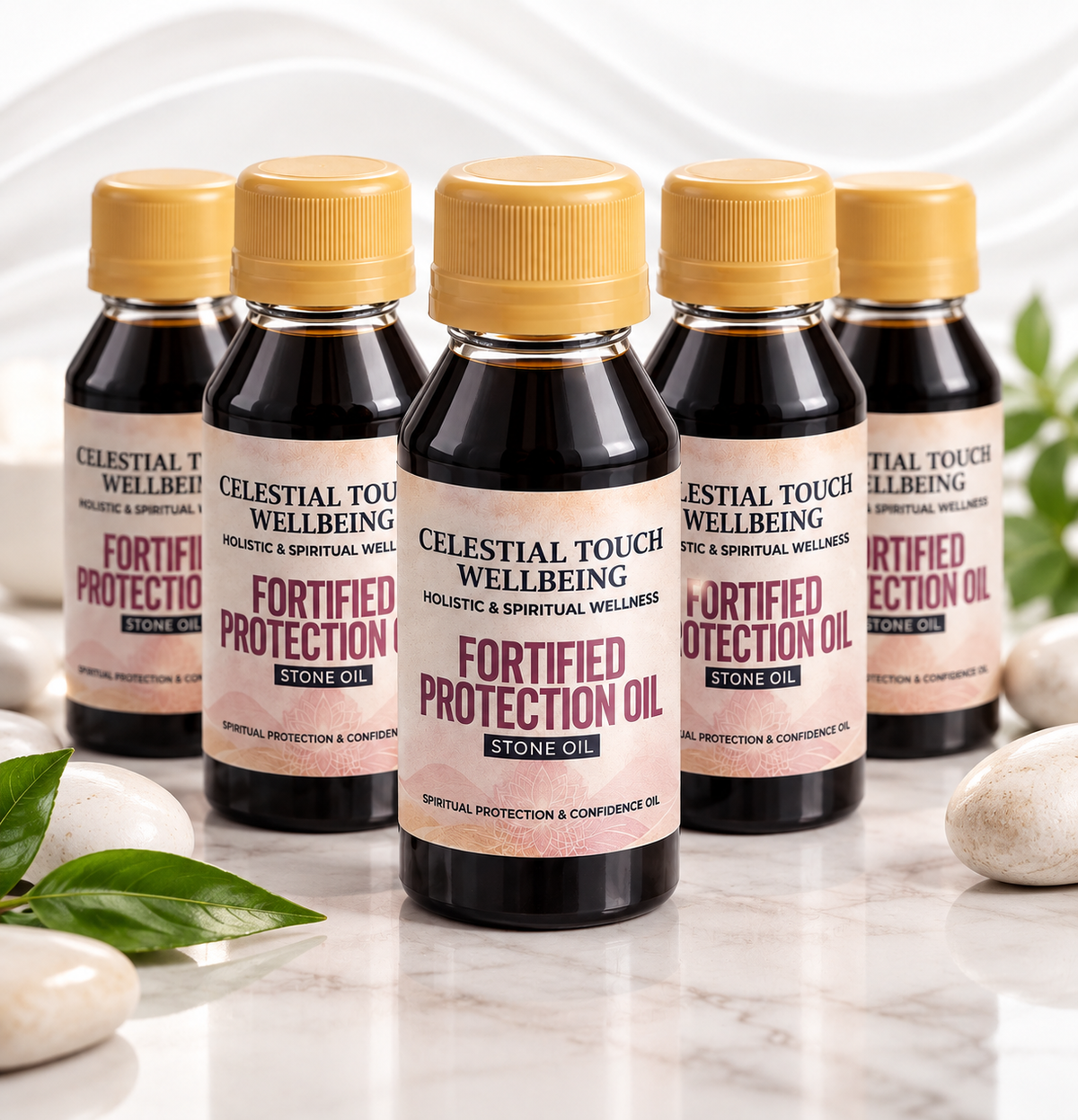 Five bottles of Celestial Touch Wellbeing Fortified Protection Oil arranged on a marble surface with decorative stones and leaves. The center bottle is in sharp focus, with the others softly blurred in the background.