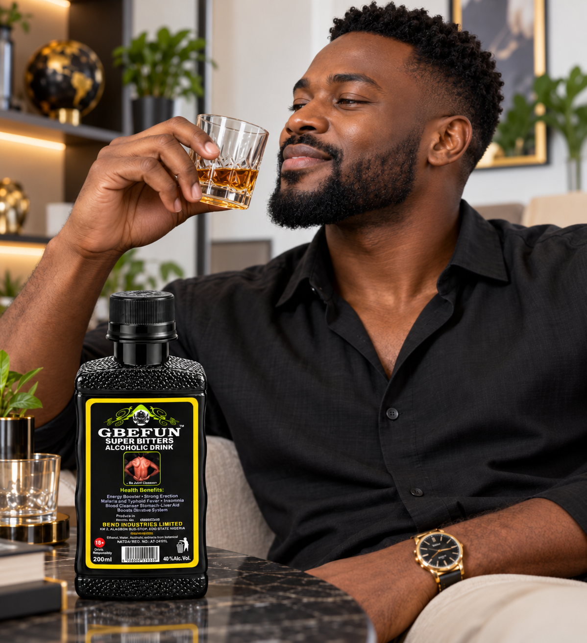 A man in a black shirt holds a glass of amber liquor while a bottle of GBFUN Super Fast Alcohol Denatur sits on a table beside him in a modern indoor setting.