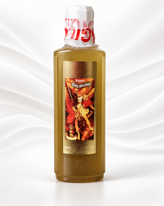 A tall rectangular bottle filled with amber-brown liquid, featuring a gold label with a vintage-style illustrated figure and red text near the neck, set against a white wavy studio background.