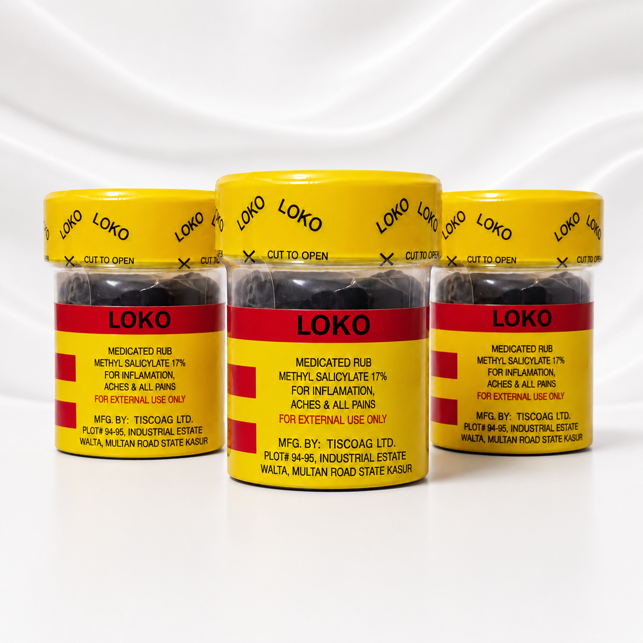 Three clear plastic jars of Loko Rub MEDICATED RUB with bright yellow lids and labels, arranged in a row on a white background with a soft shadow.