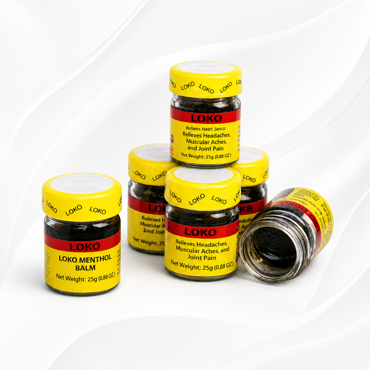 Five small jars of Loko Menthol Balm arranged on a white background, with one jar lying on its side to show the silver metal contents inside. The jars have yellow lids and labels with red and black text.