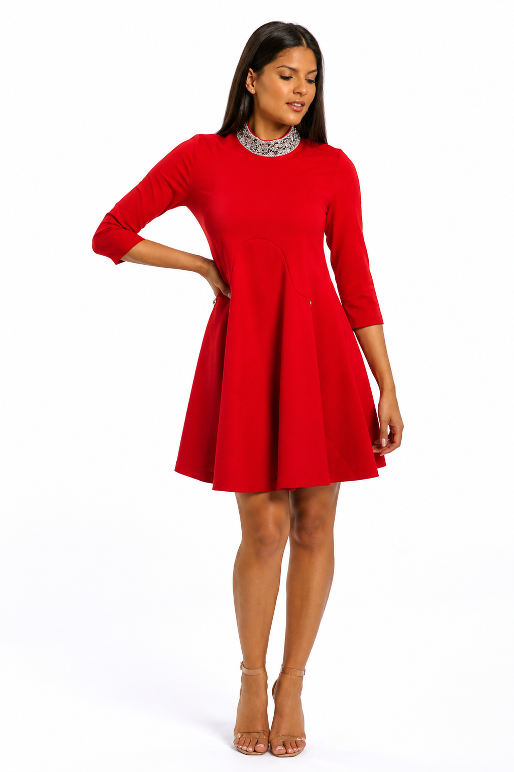 A woman modeling a bright red, three-quarter sleeve fit-and-flare mini dress with a textured, patterned silver collar, paired with tan high-heeled sandals against a plain white background.
