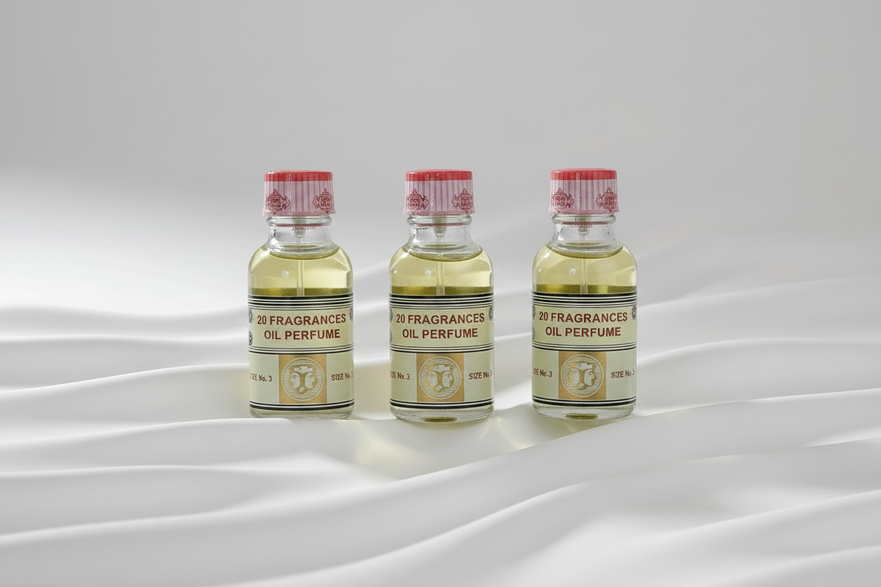 Three Perfume Oil Bottles on White Wave Background