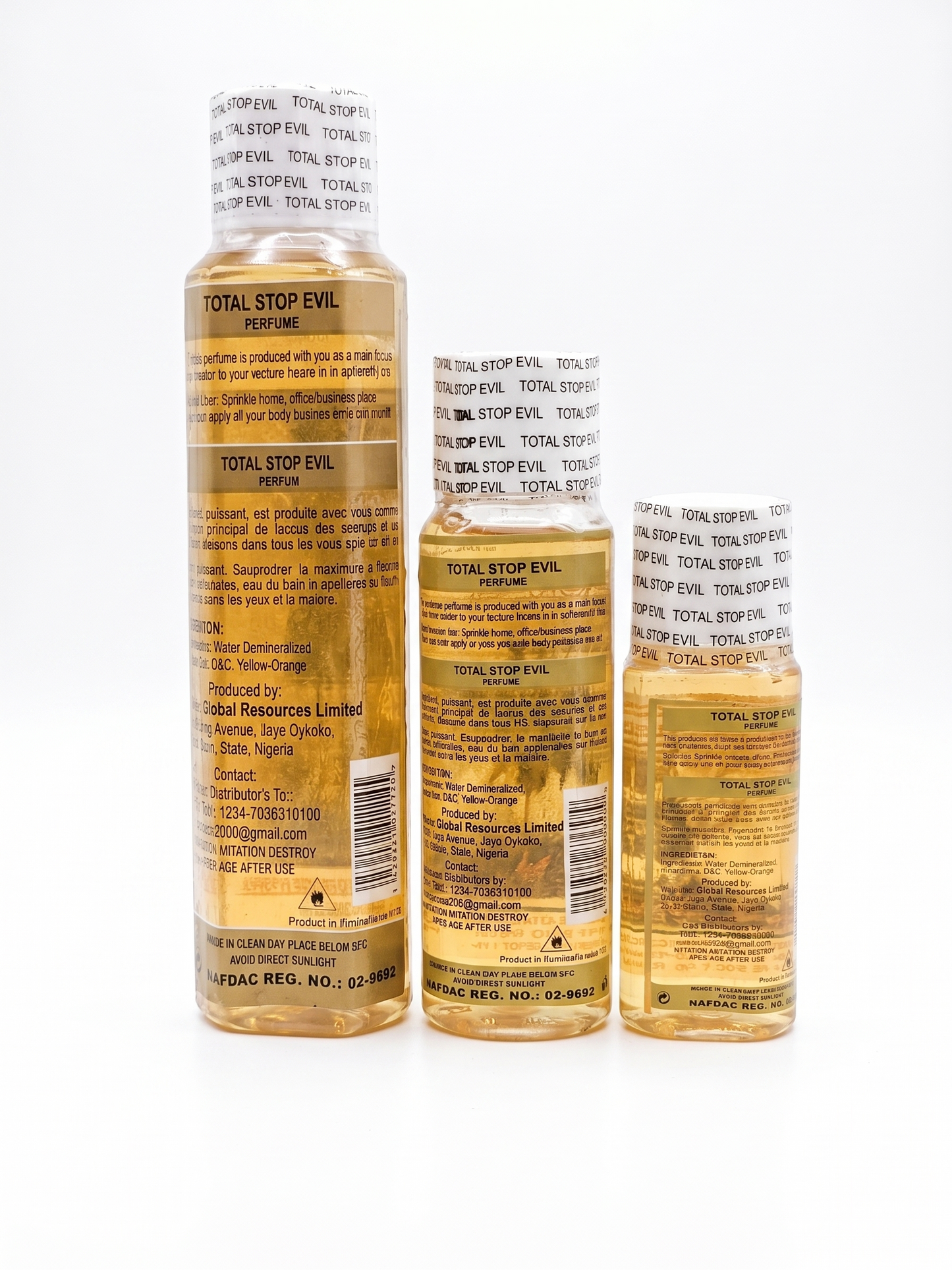 Three bottles of 'Total Stop Evil' perfume on a white background