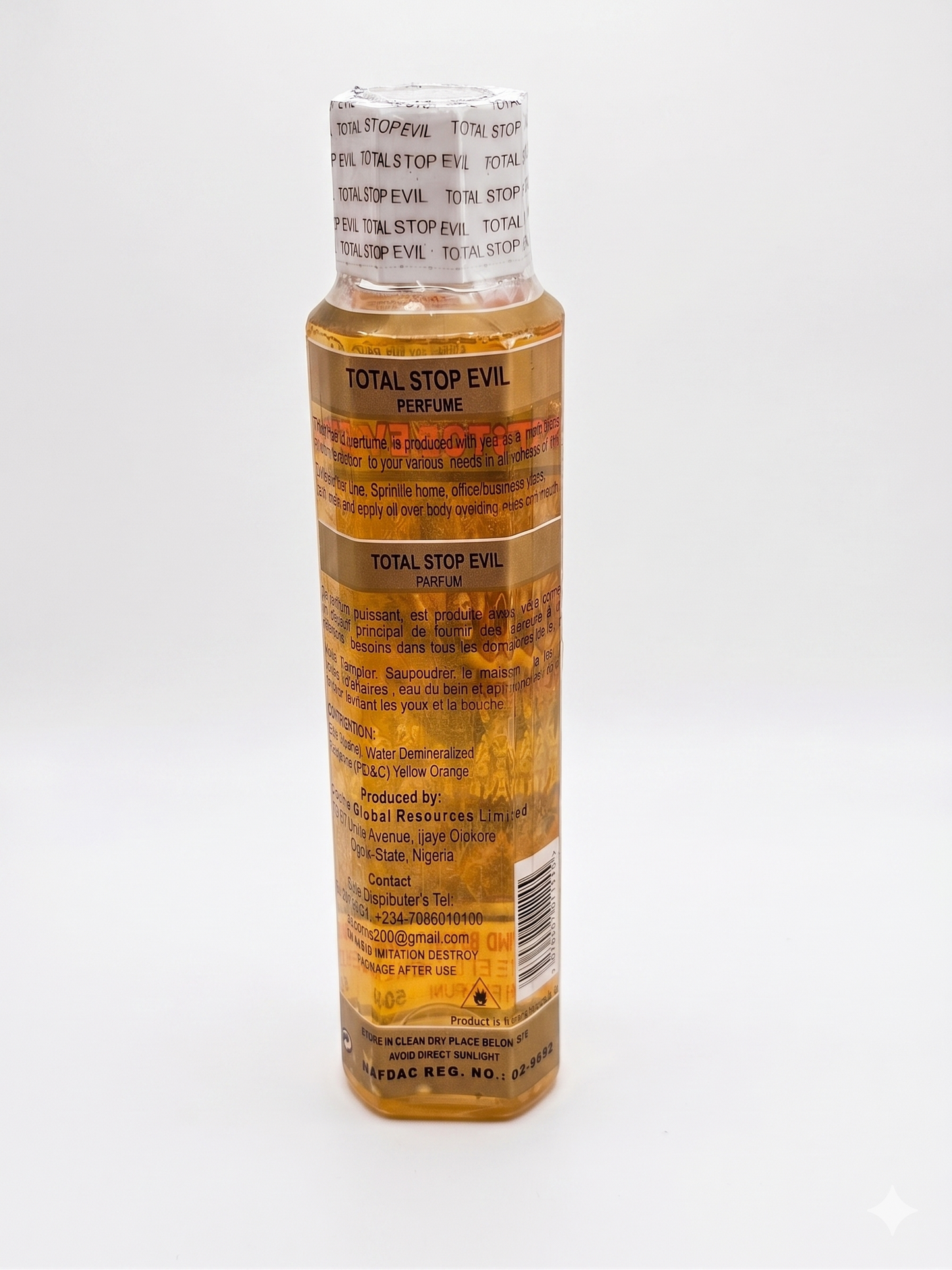 Perfume bottle labeled 'Total Stop Evil' on a white background