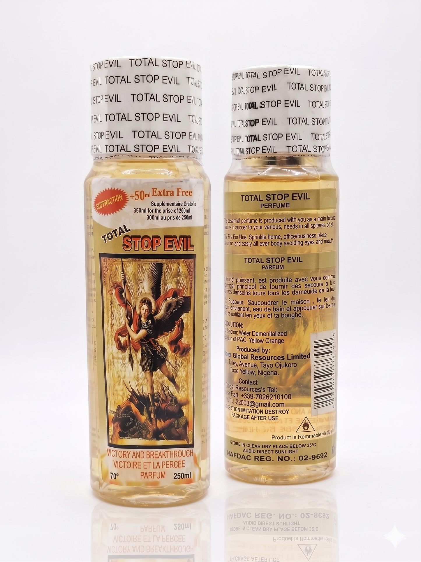 Two bottles of 'Total Stop Evil' perfume on a white background
