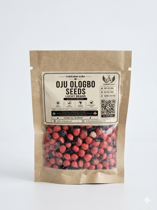 Genuine Oju Ologbo seeds for spiritual protection and warding off the 'evil eye,' showing the natural glossy red and black contrast used in African traditional rituals and talismans.