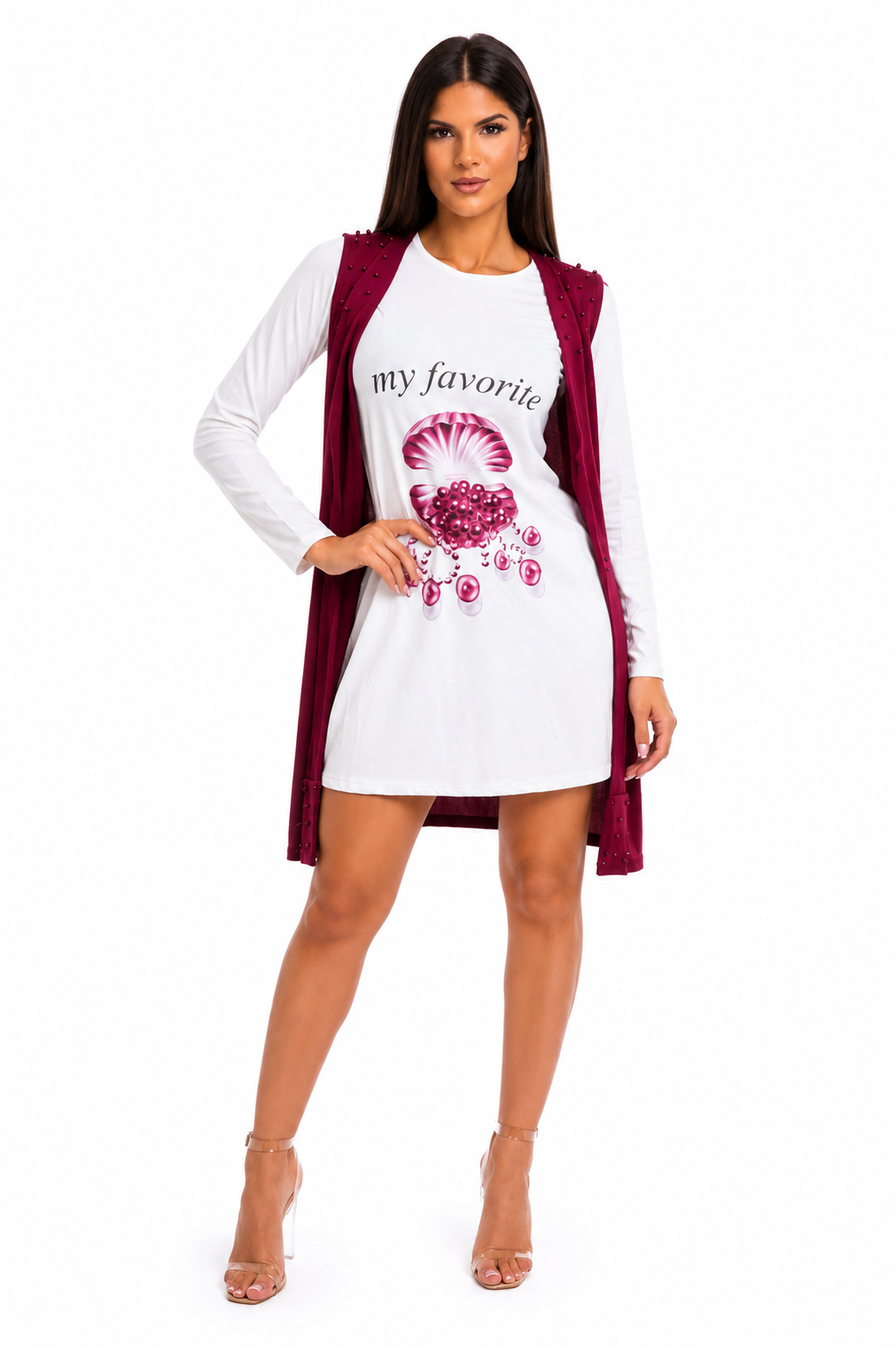 A woman modeling a white long-sleeve mini dress with a pink graphic print and the text 'my favorite', layered with a sleeveless burgundy vest, against a plain white background.